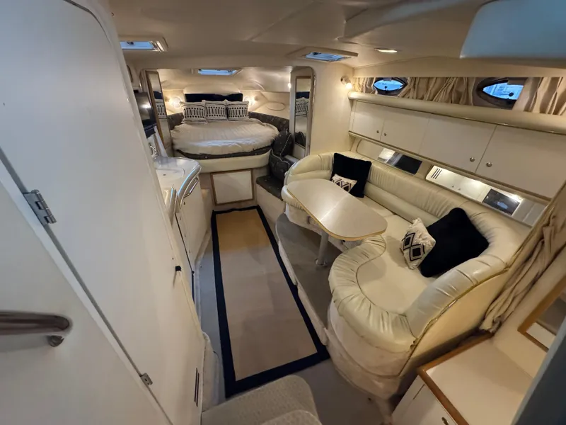 Slide: The Image of Interior of 2000 Sea Ray 340 Sundancer yacht with cozy seating and sleeping area. - 21
