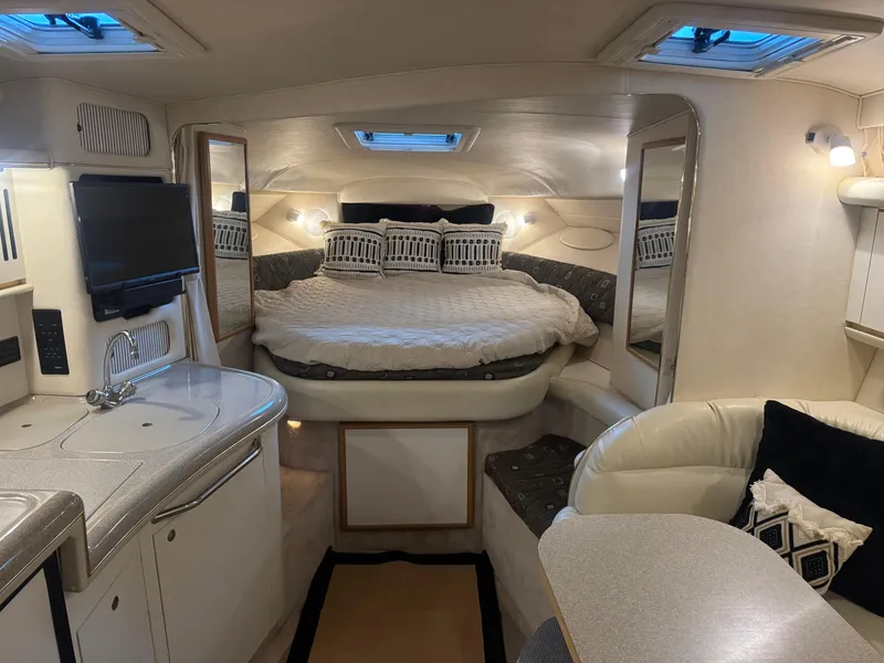 Slide: The Image of Interior of 2000 Sea Ray 340 Sundancer yacht with cozy bed and modern amenities. - 22