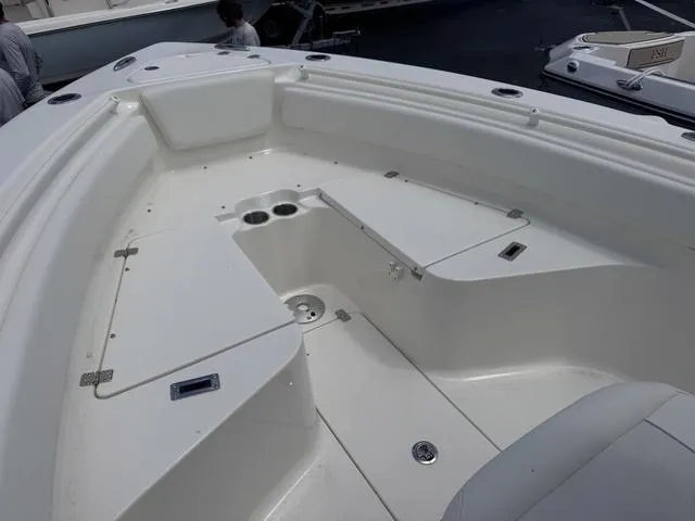 Slide: The Image of 2025 Key West 239 FSR boat interior with seating and storage compartments. - 13