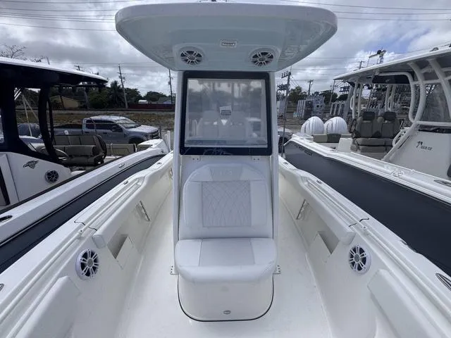 Slide: The Image of 2025 Key West 239 FSR boat interior with seating and speakers. - 4