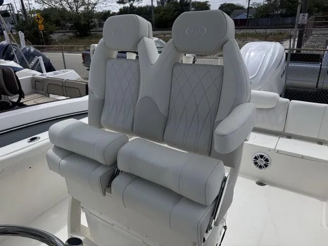 Slide: The Image of 2025 Key West 239 FSR boat with luxurious white seating and diamond stitching. - 9
