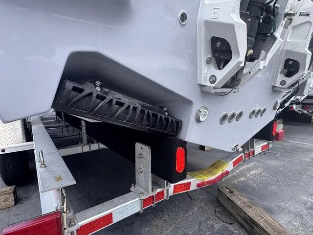 Slide: The Image of 2025 Key West 260 CC boat on trailer, showcasing hull and engine mount details. - 4