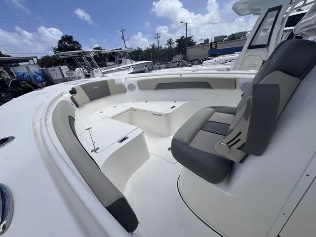 Slide: The Image of 2025 Key West 260 CC boat interior with cushioned seating and storage compartments. - 5