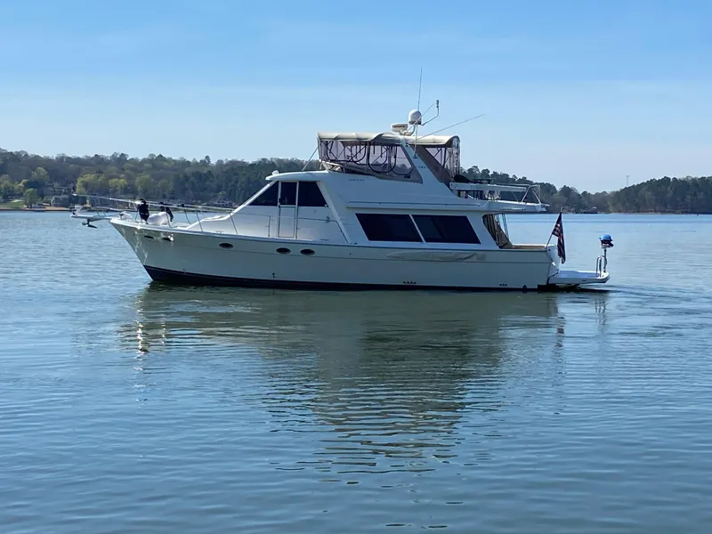 Slide: The Image of 2008 Meridian 490 Pilothouse yacht on calm water, clear sky background. - 1