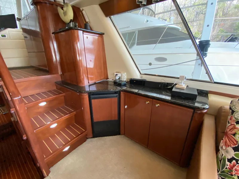 Slide: The Image of Luxurious interior of 2008 Meridian 490 Pilothouse with wooden cabinetry and staircase. - 22
