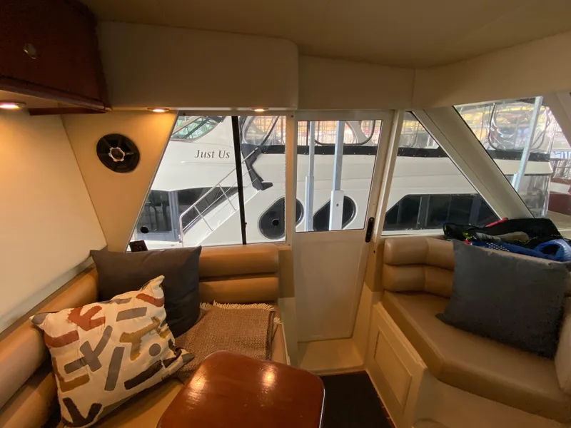 Slide: The Image of Interior of 2008 Meridian 490 Pilothouse yacht with cozy seating and decorative pillows. - 29