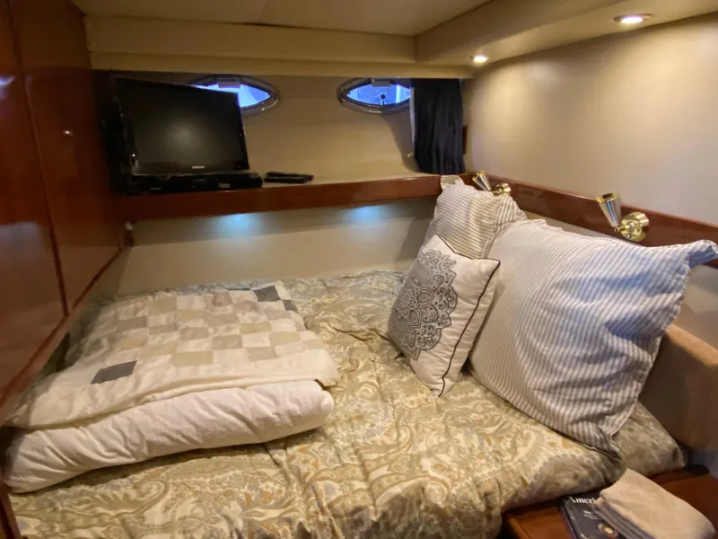 Slide: The Image of Cozy bedroom in 2008 Meridian 490 Pilothouse with TV and elegant bedding. - 32