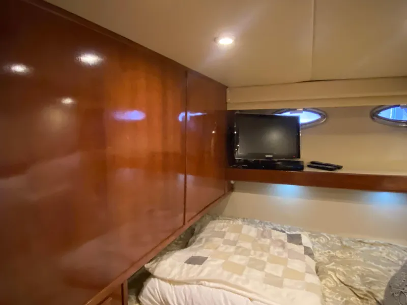 Slide: The Image of Cozy cabin interior of 2008 Meridian 490 Pilothouse with TV and wooden paneling. - 33