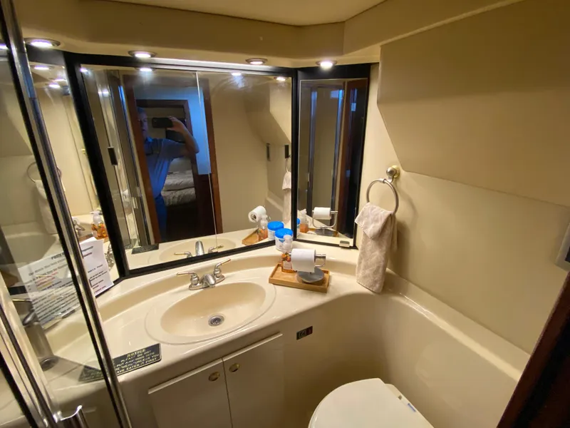 Slide: The Image of 2008 Meridian 490 Pilothouse bathroom with sink, mirror, and toilet in compact design. - 34