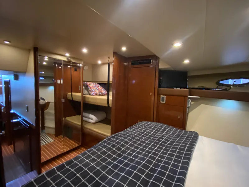 Slide: The Image of 2008 Meridian 490 Pilothouse interior with cozy cabin, bunk beds, and modern amenities. - 38