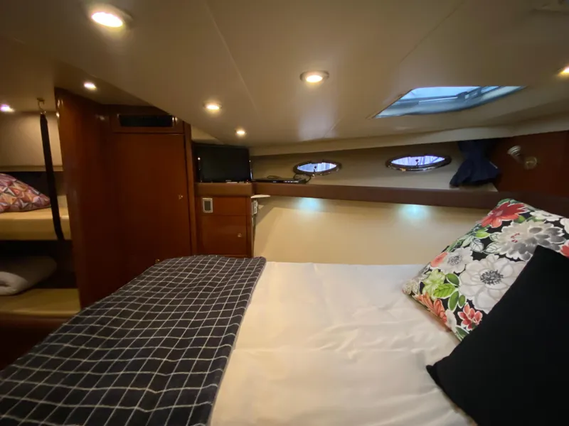 Slide: The Image of Interior of 2008 Meridian 490 Pilothouse, featuring cozy bedroom with skylight and modern decor. - 39