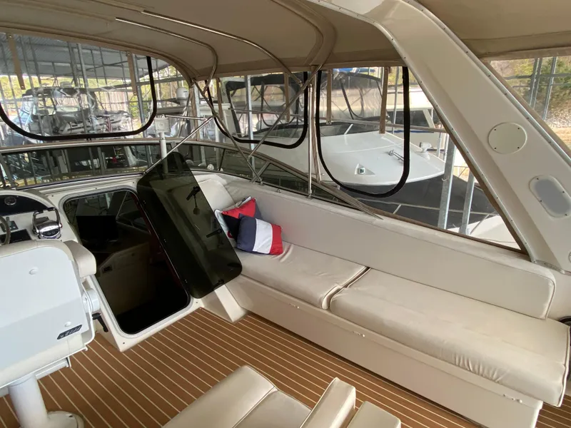 Slide: The Image of 2008 Meridian 490 Pilothouse interior with beige seating and nautical-themed pillow. - 45