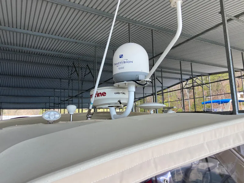 Slide: The Image of 2008 Meridian 490 Pilothouse with satellite equipment under a covered dock. - 48