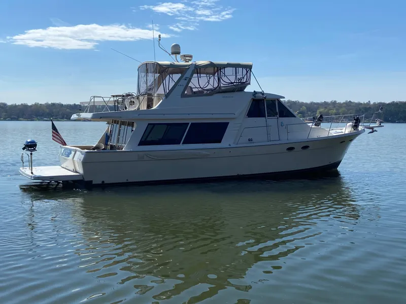Slide: The Image of 2008 Meridian 490 Pilothouse yacht on calm water under clear sky. - 5