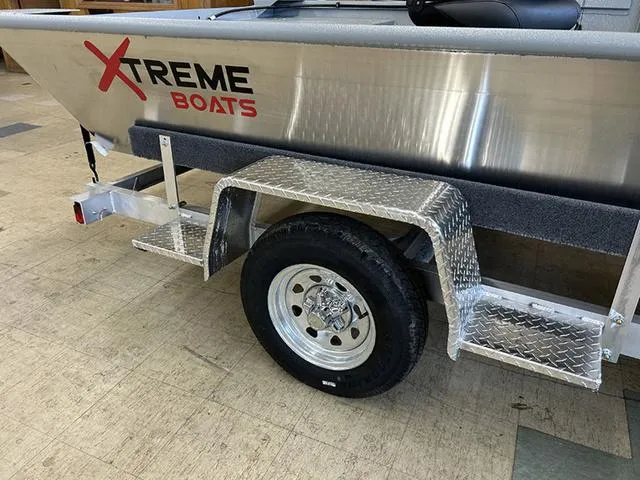 Slide: The Image of 2025 XTREME BOATS Brute 1648 SS on trailer, showcasing aluminum body and wheel detail. - 4