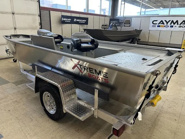 Slide: The Image of 2025 XTREME BOATS Brute 1648 SS on trailer in showroom. - 6