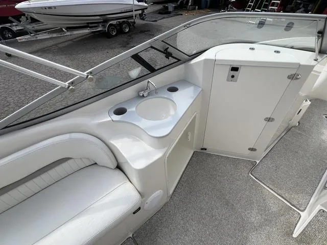 Slide: The Image of 2005 Stingray 220 DR boat interior with sink and seating area. - 5