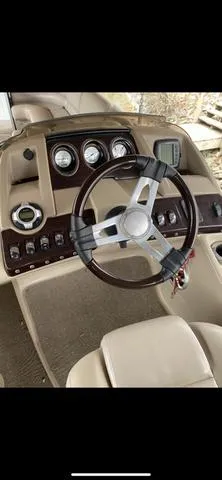 Slide: The Image of 2011 Bennington 2550 RCL boat dashboard with steering wheel and gauges. - 5