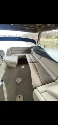 Slide: The Image of 2011 Bennington 2550 RCL boat interior with spacious seating and lake view. - 6