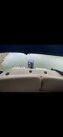 Slide: The Image of 2011 Bennington 2550 RCL boat interior with water view and seating area. - 7