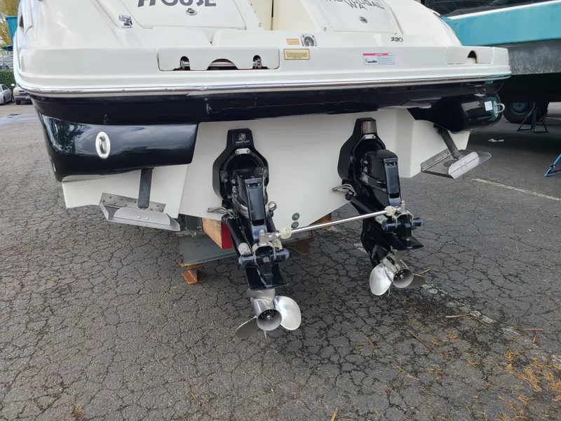 Slide: The Image of 2006 Sea Ray 290 Sun Sport boat with dual propellers on a trailer. - 21