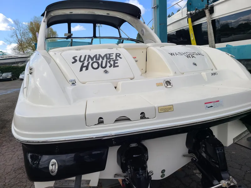 Slide: The Image of 2006 Sea Ray 290 Sun Sport boat named "Summer House" docked, rear view. - 22