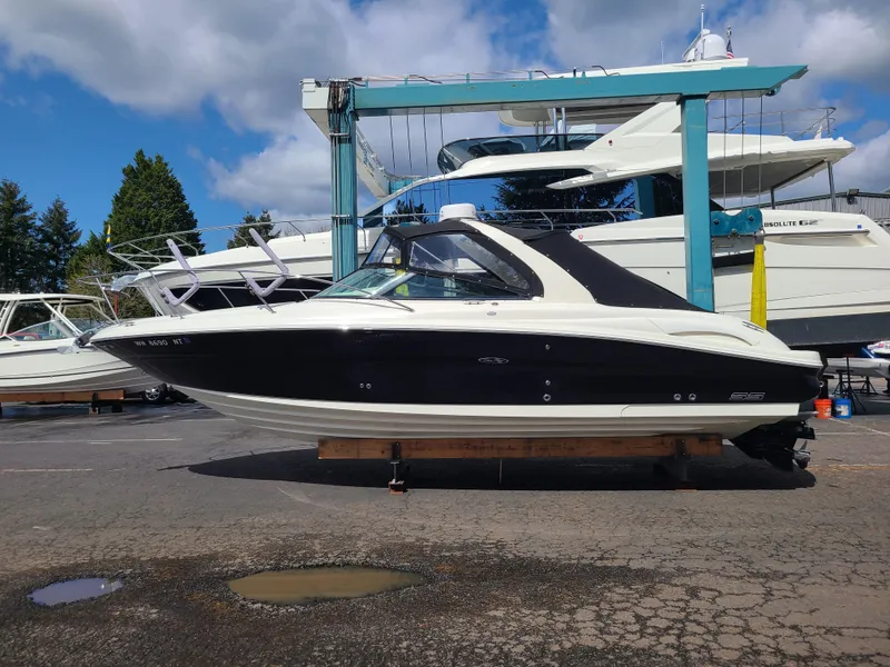 Slide: The Image of 2006 Sea Ray 290 Sun Sport boat on display at a marina. - 4