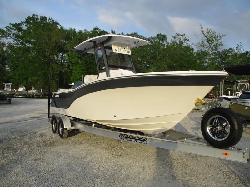 Slide: The Image of 2025 Sea Fox 248 Commander boat on trailer, parked outdoors. - 1