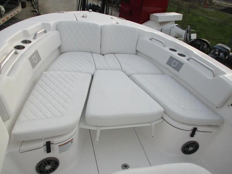 Slide: The Image of 2025 Sea Fox 248 Commander boat with white cushioned seating area. - 10