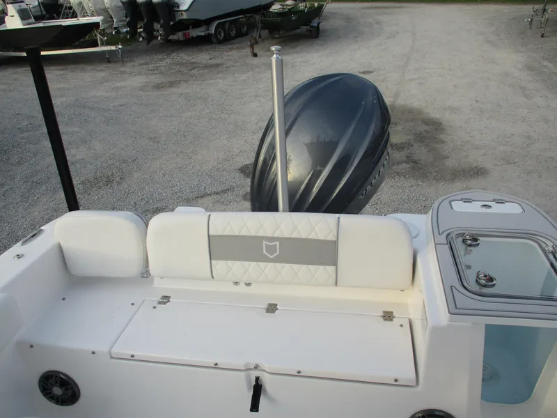Slide: The Image of 2025 Sea Fox 248 Commander boat interior with seating and engine view. - 12