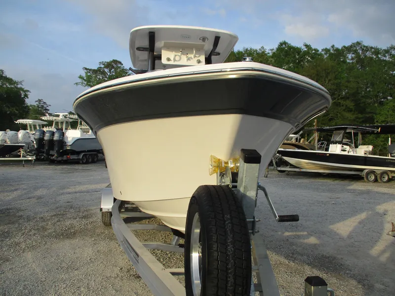 Slide: The Image of 2025 Sea Fox 248 Commander boat on trailer, parked outdoors. - 3