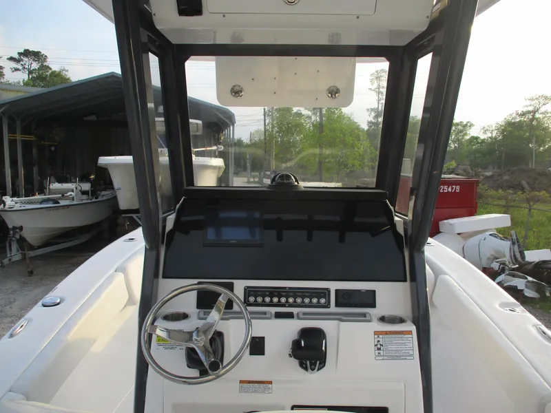Slide: The Image of 2025 Sea Fox 248 Commander boat dashboard with steering wheel and controls. - 6