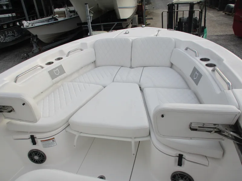 Slide: The Image of 2025 Sea Fox 248 Commander boat with spacious white cushioned seating area. - 9