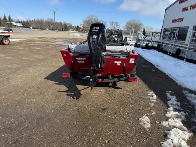 Slide: The Image of 2019 Tracker Super Guide V-16 SC boat with 40 HP motor in a snowy parking lot. - 18