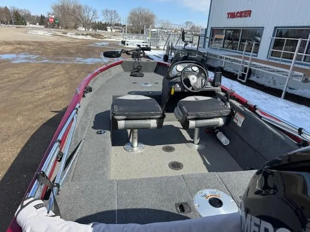 Slide: The Image of 2019 Tracker Super Guide V-16 SC boat with dual seats and steering console. - 19