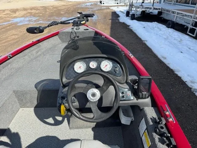 Slide: The Image of 2019 Tracker Super Guide V-16 SC boat dashboard with steering wheel and gauges. - 20