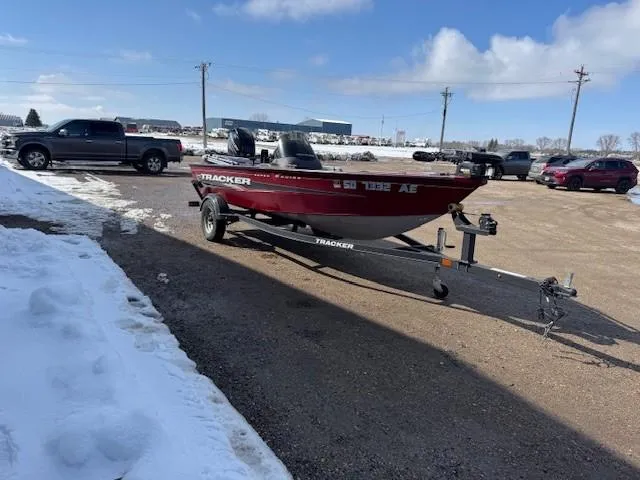 Slide: The Image of 2019 Tracker Super Guide V-16 SC boat on trailer in snowy parking lot. - 22