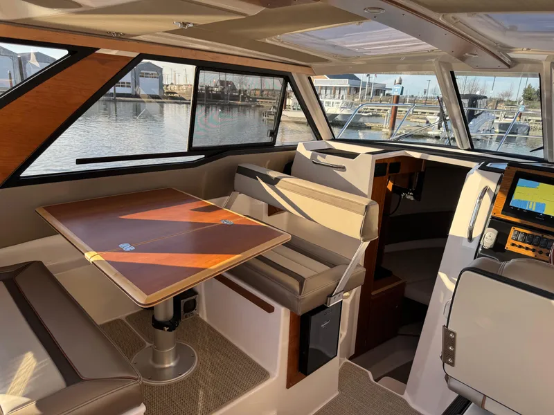 Slide: The Image of Interior of 2025 Cutwater C-288 Coupe boat with seating and navigation system. - 14