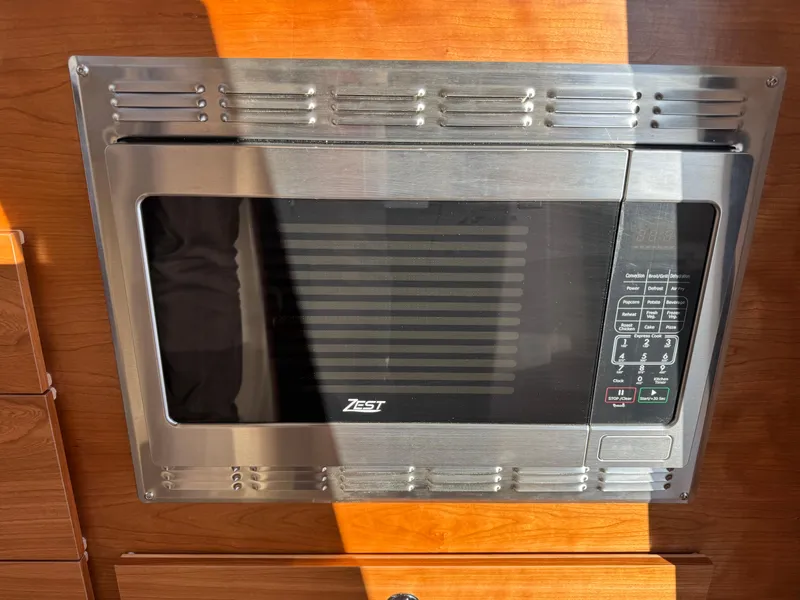 Slide: The Image of Built-in microwave in 2025 Cutwater C-288 Coupe boat kitchen. - 25