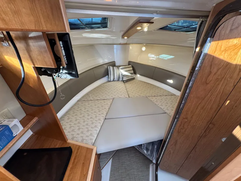 Slide: The Image of Interior of 2025 Cutwater C-288 Coupe, featuring a cozy cabin with modern amenities. - 31