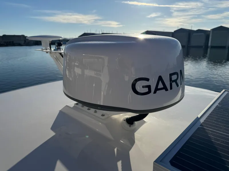 Slide: The Image of Garmin radar on 2025 Cutwater C-288 Coupe boat, docked by calm water. - 36
