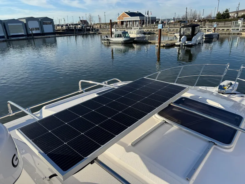 Slide: The Image of 2025 Cutwater C-288 Coupe with solar panels docked at a marina. - 37