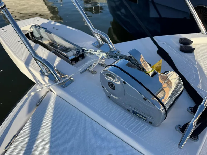 Slide: The Image of 2025 Cutwater C-288 Coupe boat anchor system on deck, featuring polished metal components. - 38