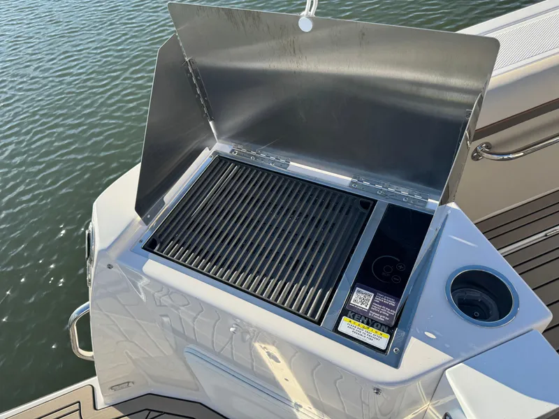 Slide: The Image of Outdoor grill on 2025 Cutwater C-288 Coupe boat, docked by water. - 39