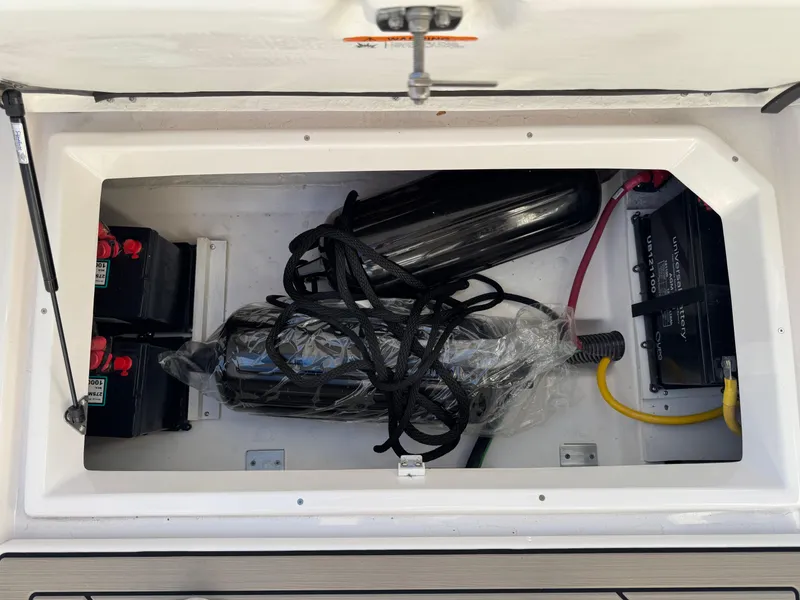 Slide: The Image of 2025 Cutwater C-288 Coupe storage compartment with batteries and equipment. - 41