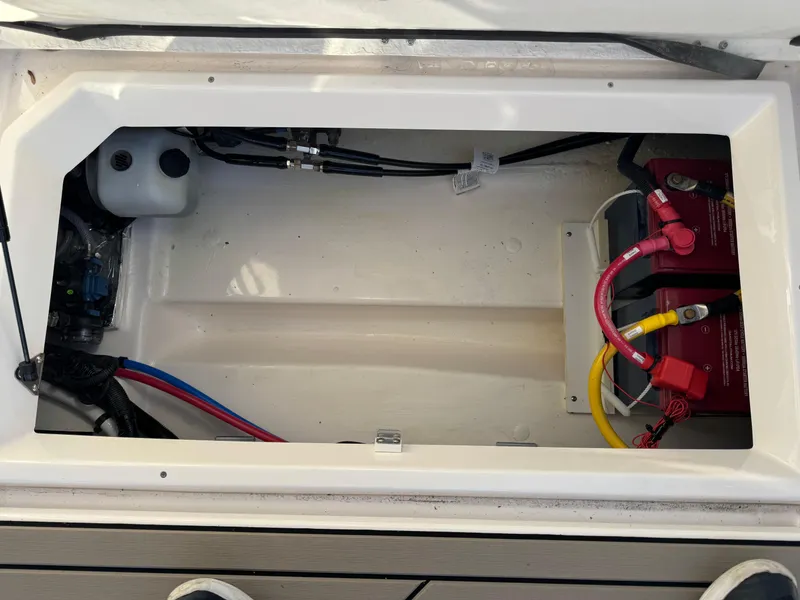 Slide: The Image of 2025 Cutwater C-288 Coupe battery compartment with wiring and components. - 43