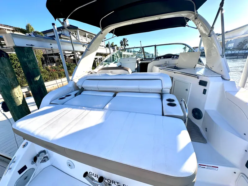 Slide: The Image of 2017 Regal 32 Express boat with spacious deck and seating area. - 16