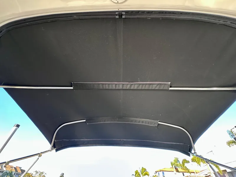 Slide: The Image of 2017 Regal 32 Express boat canopy with metal support frame, viewed from below. - 32