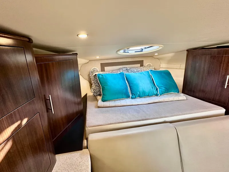 Slide: The Image of Interior cabin of 2017 Regal 32 Express with bed and wooden cabinets. - 37