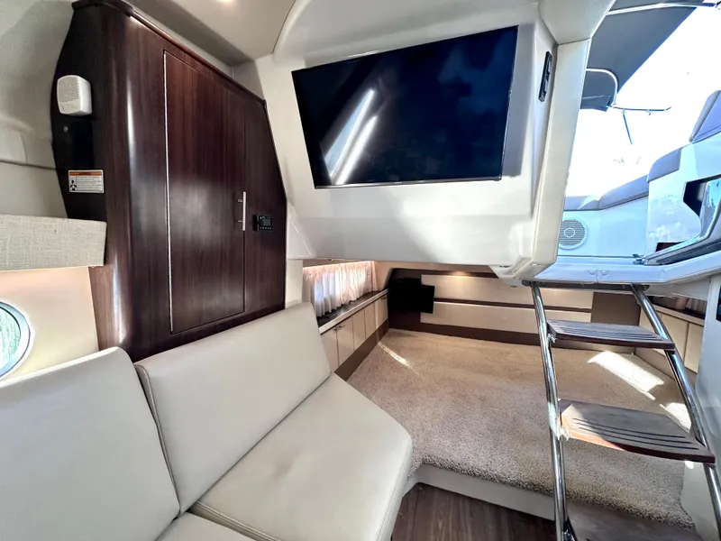 Slide: The Image of Interior of 2017 Regal 32 Express yacht with modern seating and mounted TV. - 42